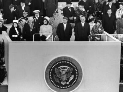 American President John Fitzgerald Kennedy stands a platform for i- Old Photo