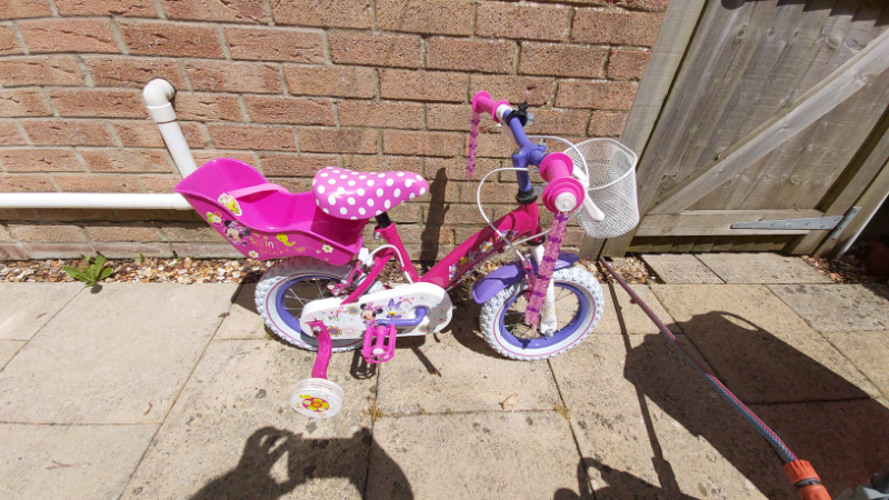 minnie mouse bike with doll carrier