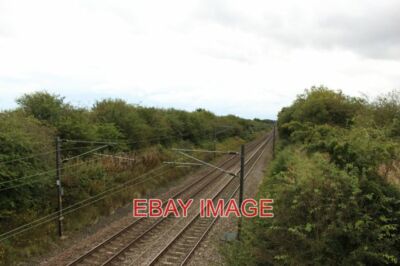 PHOTO  THE EAST COAST MAINLINE PASSING BRUNTON AIRFIELD THE EAST COAST MAINLINE