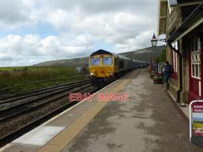 PHOTO  A SOUTHBOUND FREIGHT TRAIN PASSES THROUGH RIBBLEHEAD RAILWAY STATION RIBB