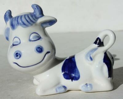 Cow Figurine Cartoon Comic Style Smile Eyes Closed Ceramic Blue White Lying Down