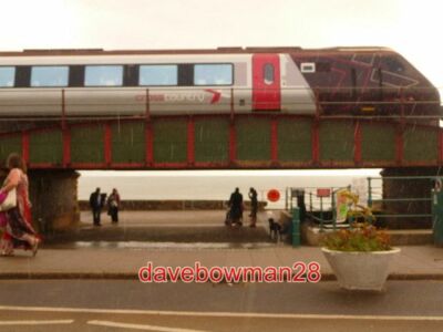 PHOTO  DAWLISH: A TRAIN HEADS SOUTH A SOUTHBOUND TRAIN HAS JUST LEFT DAWLISH STA