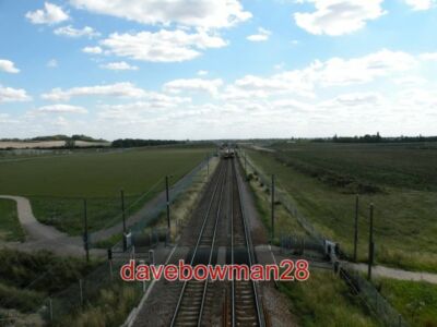PHOTO  TRAINS THAT PASS NORTH- AND SOUTHBOUND TRAINS PASS EACH OTHER JUST SOUTH