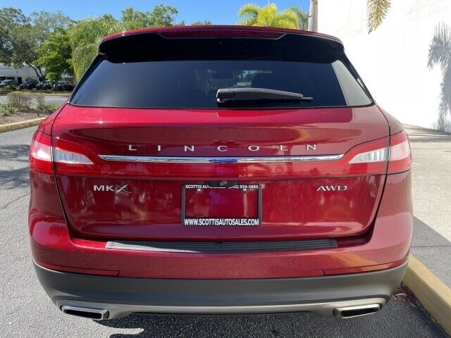 2016 Lincoln MKX, Ruby Red Metallic Tinted Clearcoat with 102213 Miles available