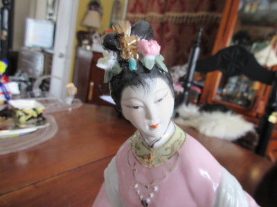 # 7 figurine of a women made in China hand painted 9.5