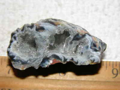 Agate geode half cut and polished with druzy crystal filled center 1.5'' U96