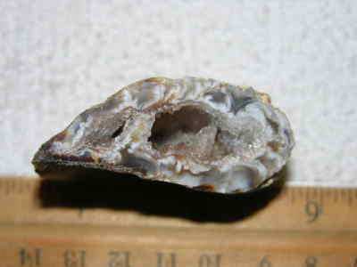 Agate geode half cut and polished with druzy crystal filled center 2'' U5