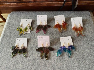 Handmade resin simulated fairy wing earrings with crystals.