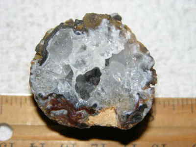 Agate geode half cut and polished with druzy crystal filled center 1.5'' U86