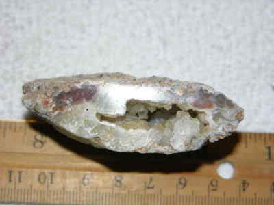 Agate geode half cut and polished with druzy crystal filled center 2'' U10