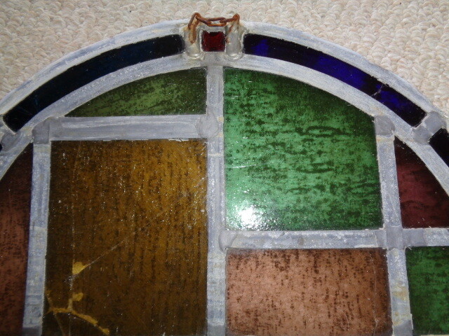 19th century half moon stained glass window blue amber green red tuquoise colors