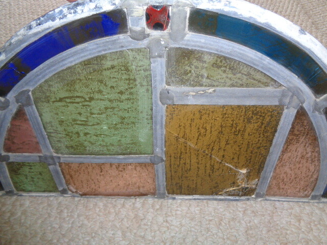 19th century half moon stained glass window blue amber green red tuquoise colors