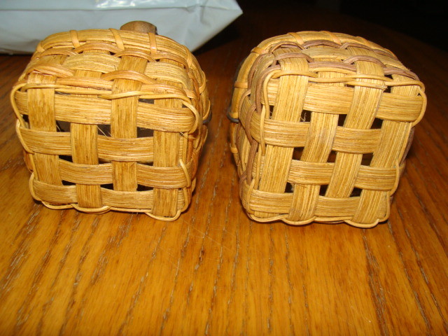 TWO MATCHING SMALL THATCHED BASKETS WITH HANDLES