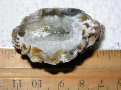 Agate geode half cut and polished with druzy crystal filled center 1.5'' U79