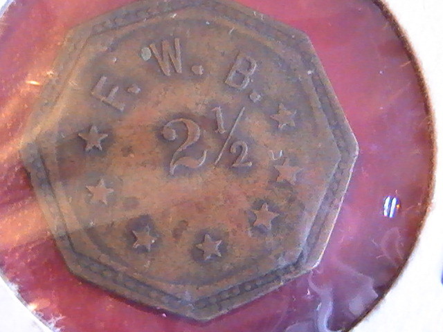 TOKEN F W B 2 1/2  OCTAGON BRASS 1 INCH