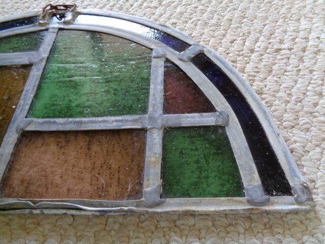 19th century half moon stained glass window blue amber green red tuquoise colors