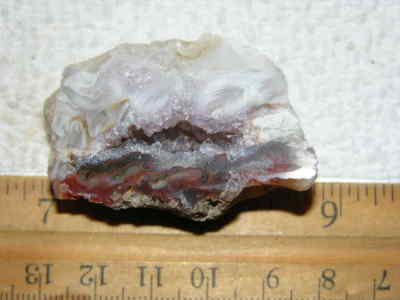 Agate geode half cut and polished with druzy crystal filled center 2'' U67