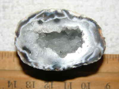 Agate geode half cut and polished with druzy crystal filled center 1.5'' U27