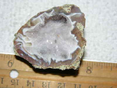 Agate geode half cut and polished with druzy crystal filled center 2'' U41