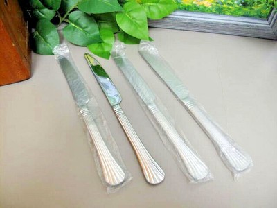 International Stainless CASCADE Serrated Dinner Knives ~ Four ~ New