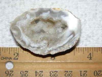 Agate geode half cut and polished with druzy crystal filled center 1.5'' U91