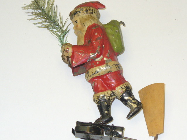 GUNTHERMANN TIN HAND=PAINTED, WIND UP FLYING SANTA