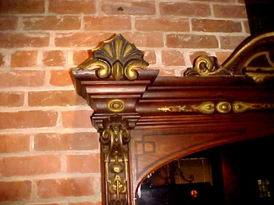 ANTIQUE EAST LAKE MIRROR, SURRONDED BY HAND CARVED WALNUT ORNATE FRAMING