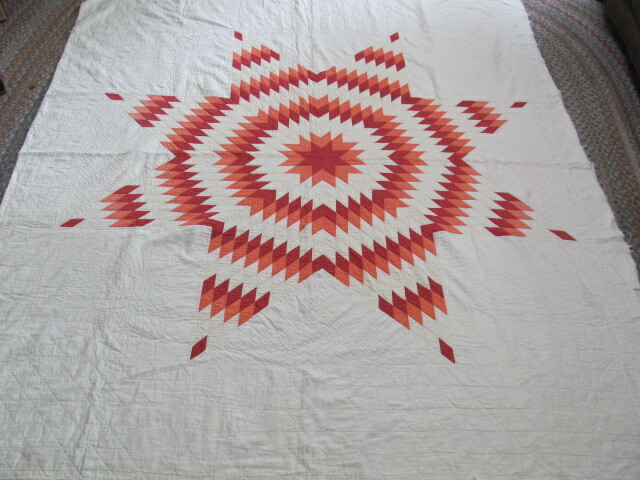 Antique Texas Lone Star quilt in red and coral hand quilted from estate