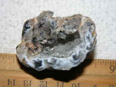 Agate geode half cut and polished with druzy crystal filled center 1.5'' U90