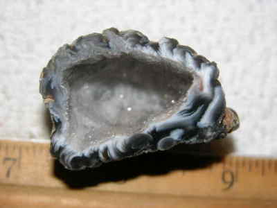 Agate geode half cut and polished with druzy crystal filled center 1.5'' U80