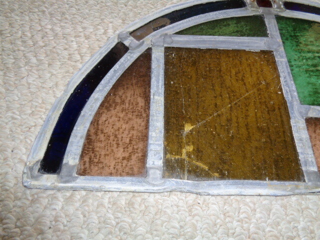 19th century half moon stained glass window blue amber green red tuquoise colors