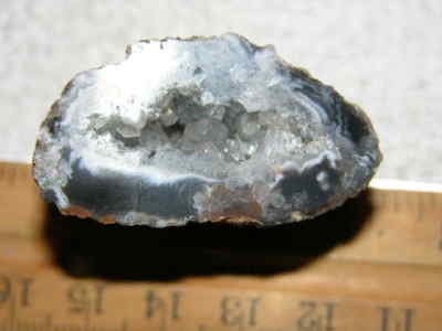 Agate geode half cut and polished with druzy crystal filled center 1.5'' U76