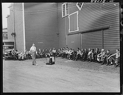 Richwood, West Virginia. Evangelist preaching in yard of lumber mill]