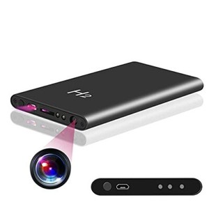 Portable projector with purple light beam and remote control.