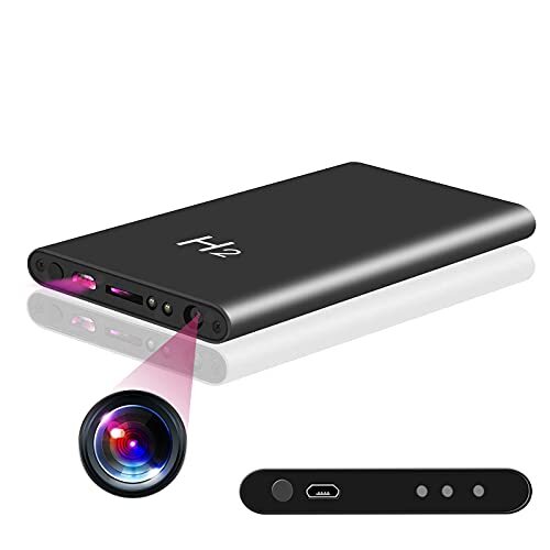 Portable projector with purple light beam and remote control.