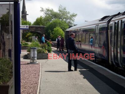 PHOTO  WAITING AT INVERGORDON A SHORT DELAY WAITING FOR A SOUTHBOUND TRAIN TO CR