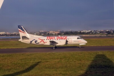 PHOTO  REX SAAB 340B VH-ZLO AT THE CHARLES KINGSFORD SMITH AIRPORT SYDNEY