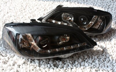 DE SCHEINWERFER SET für OPEL ASTRA G TAGFAHRLICHT LED TFL LOOK SCHWARZ + LAMPEN