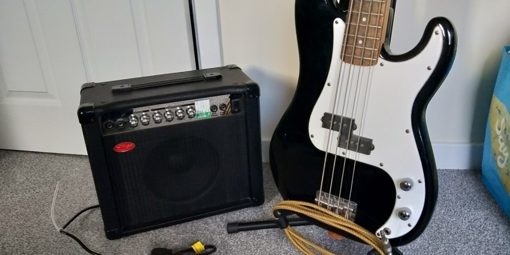 Bass Guitar + Combo P Bass by Squier and small comb great beginner