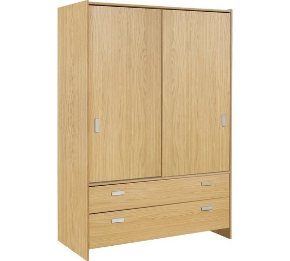 Ex display Oak colour wardrobe. 2 sliding doors and drawers. Less 1/4
