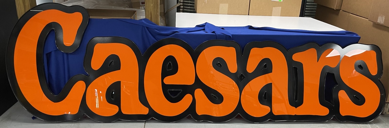 Little Caesars translucent sign face 8 feet long and 28