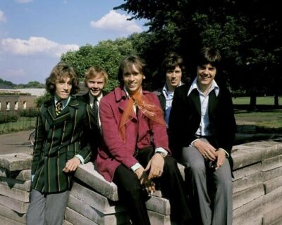 The Bee Gees rare 1960's pose of the five Gibb brothers by wall 24x30 poster