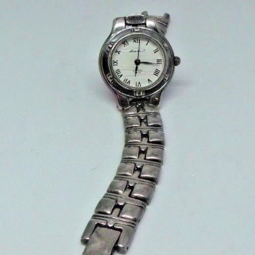 Lady's Eddie Bauer watch for parts or repair. Back cover is missing.