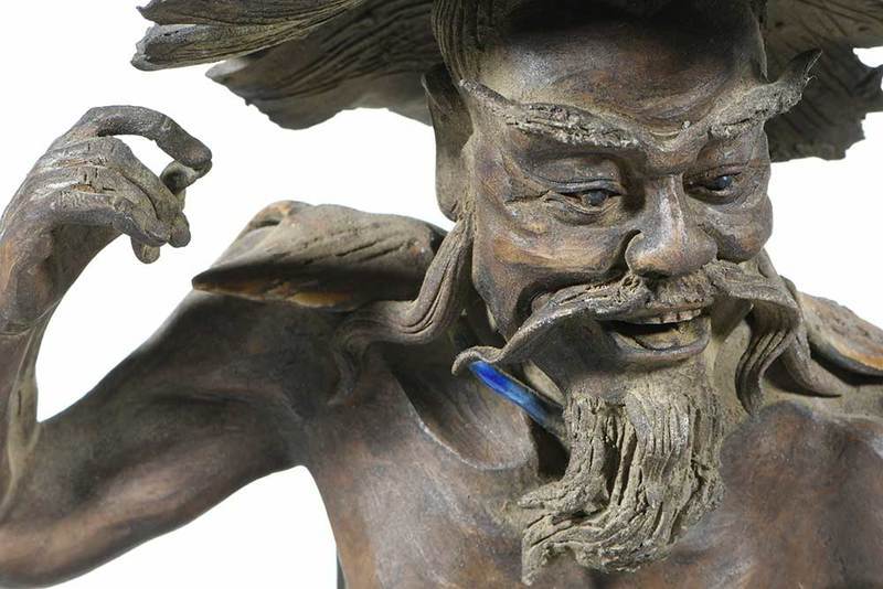 Signed Japanese ceramic sculpture enameled 'fisherman'