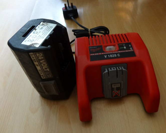 Milwaukee 1828 Volt Battery Charger & genuine 24v battery. Cost over £