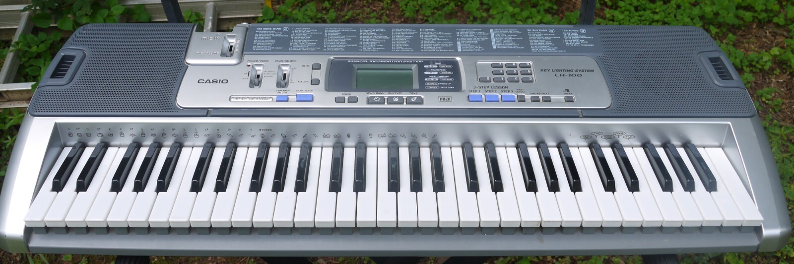 Casio LK-100 Keyboard 61 Key Lighted Key 100 Songs 100 Tones