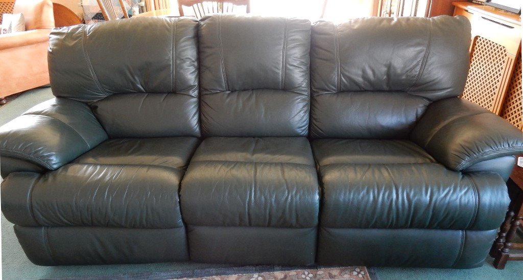 Leather sofa dark green recliner good condition Splits into 3 for