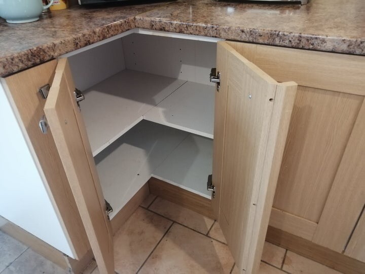 Kitchen with worktops, corner unit and pull out spice rack in