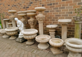 Large selection of stone garden urn planters, columns etc