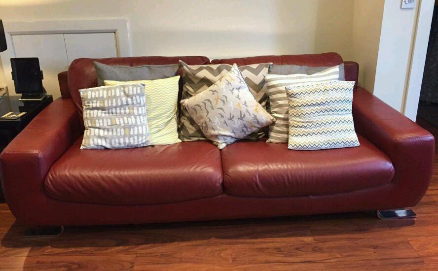 Ox blood red Italian leather 4 seat sofa and chair. in Doagh, County